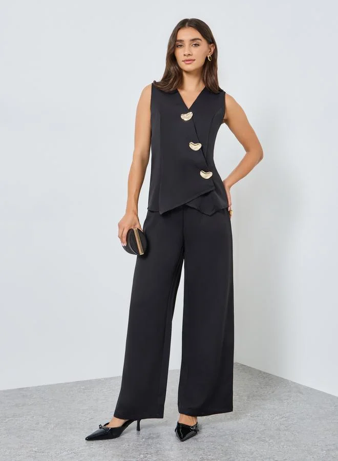 Styli  Women Sleeveless Asymmetric Jumpsuit with Fancy Buttons for Women | Best Price UAE